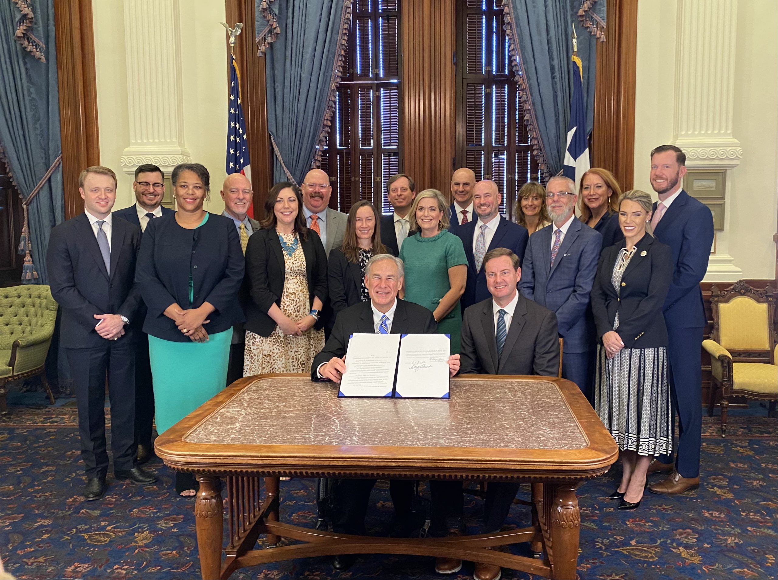 Governor Greg Abbott and members of the water community celebrate his signing of SB 28 to make it law.